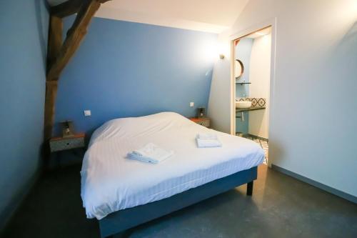 מיטה או מיטות בחדר ב-Le Remarquable