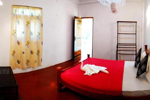 Postel nebo postele na pokoji v ubytování Suba Home Stay
