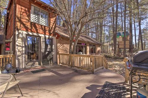 a wooden house with a porch and a deck at Near Tonto National Forest Dog-Friendly Cabin! in Payson
