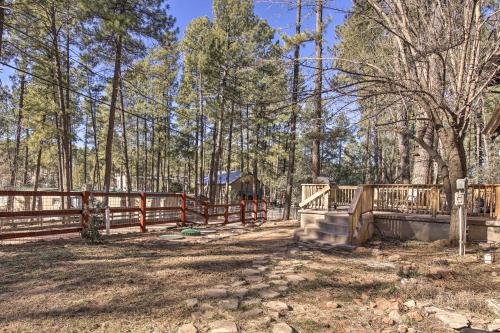 a wooden fence in a yard with trees at Near Tonto National Forest Dog-Friendly Cabin! in Payson