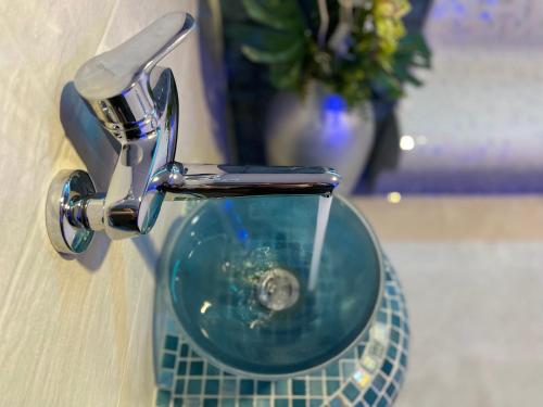 a close up of a bathroom sink with a faucet at Smart Hotel Budapest in Budapest