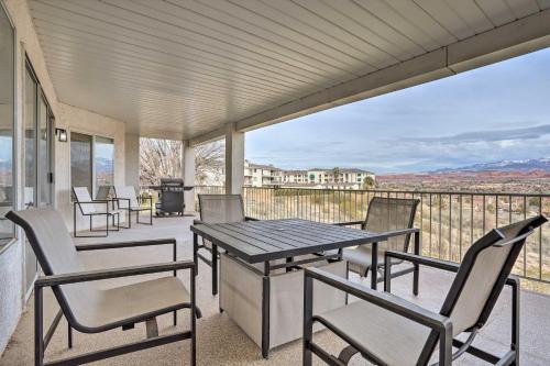 a porch with chairs and a table and a grill at Luxe Family Condo with Mtn View and Resort Perks! in St. George