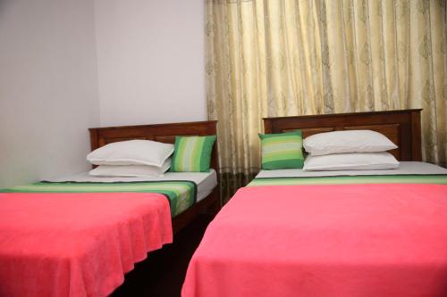 Postel nebo postele na pokoji v ubytování Super Spot Guest House