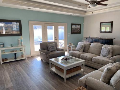 a living room with a couch and a coffee table at Hidden Beach Oasis in Myrtle Beach