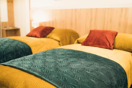 Ένα ή περισσότερα κρεβάτια σε δωμάτιο στο Harmonia Apartamenty Ustroń