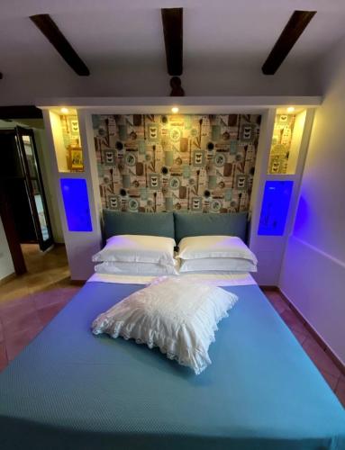 A bed or beds in a room at Giuali'