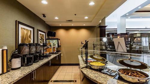 a buffet line with sinks in a hotel room at Staybridge Suites Laredo by IHG in Laredo