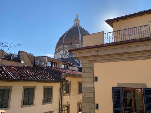 a view of a building with a dome in the background at Residenza dei Pucci in Florence