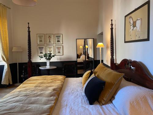 a bedroom with a large bed in a room at Residenza dei Pucci in Florence