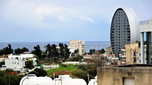 a view of a city with a tall building at Antonakis 501 in Limassol