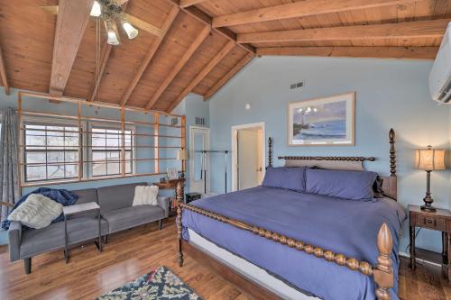 a bedroom with a large bed and a couch at Private Beach Waterfront Disney Getaway! in Disney