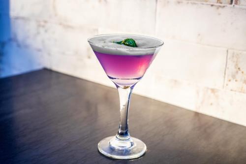 a drink in a glass sitting on a table at Hyatt Place New York Chelsea in New York