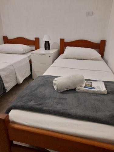 Ένα ή περισσότερα κρεβάτια σε δωμάτιο στο LÍAH Hostel & Suites