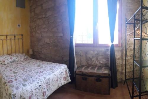 เตียงในห้องที่ Antiguo Molino de Aceite de Alforque