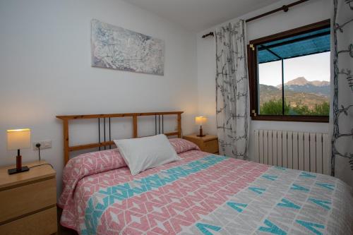 a bedroom with a bed and a window with a view at OLIVAR de S’HERETAT Trekking/ruta GR-221 (ETV/2099) in Sóller