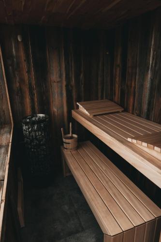 a wooden cabin with two bunk beds in it at Jufenalm BOHO & Wellnesshotel in Maria Alm am Steinernen Meer