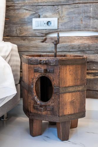 an old wooden box with a sink in a room at Silo Luxury Rooms in Nafplio