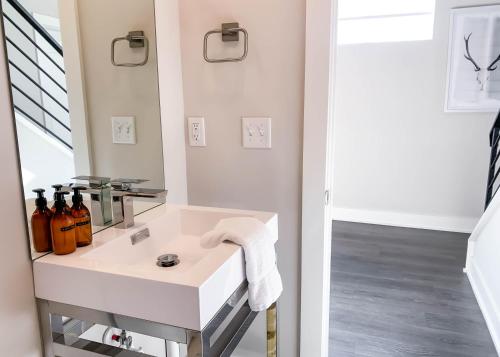 a bathroom with a sink and a mirror at Mason Lofts at West End in Nashville