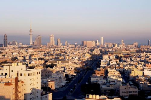 an aerial view of a city with a lot of buildings at Le Jazz Hotel in Kuwait