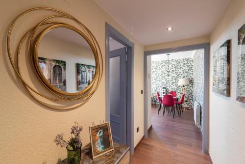a hallway with a large mirror on the wall at Arista Huesca in Huesca