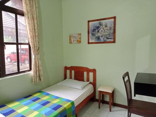 Giường trong phòng chung tại ROSSA HOLIDAY APARTMENT