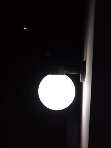 a street light with a white light in the dark at La Petite Maison in Nazca