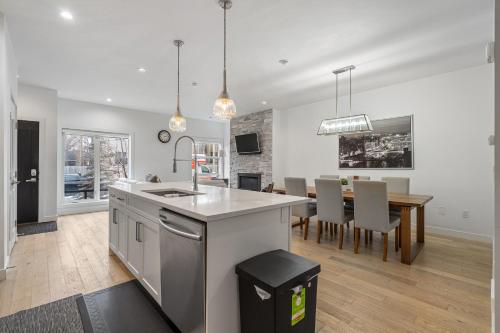 a kitchen and dining room with a dining table at Luxury Spacious Private House near City Centre in Calgary