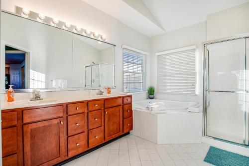 a bathroom with a tub and a sink and a shower at Bethany Lakes --- 31302 Terry Circle in Bethany Beach