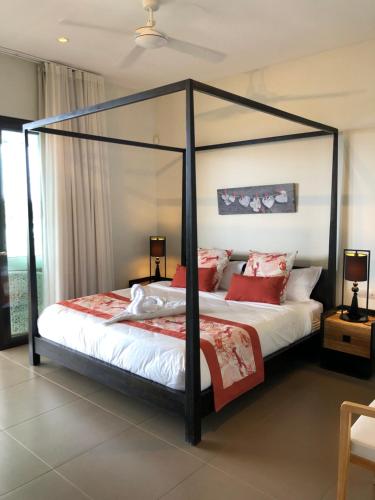 Cama o camas de una habitación en Penthouse 3 chambres Vue Lagon imprenable