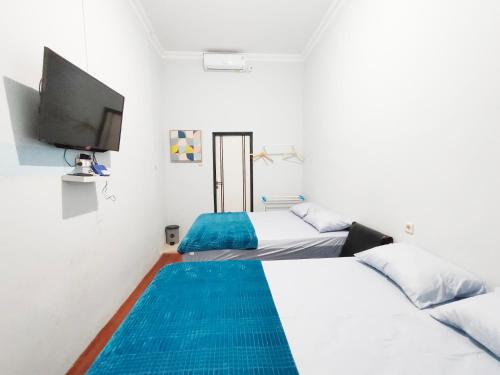 Postel nebo postele na pokoji v ubytování Ministry Homestay