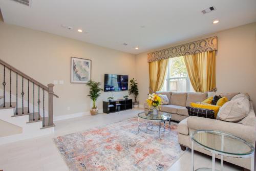 a living room with a couch and a table at Elegant East Downtown House Houston TX in Houston