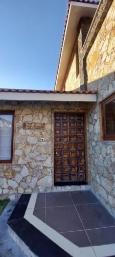 a building with a garage door and a tennis court at Vikrama Heritage Resort Pavagadh in Hālol