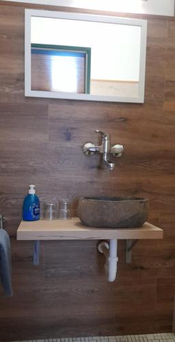 a bathroom with a sink and a mirror at Landgasthof Hotel Zur Waage in Marienhafe