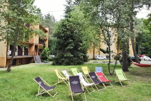 a group of lawn chairs sitting in the grass at 'Reset in Spała