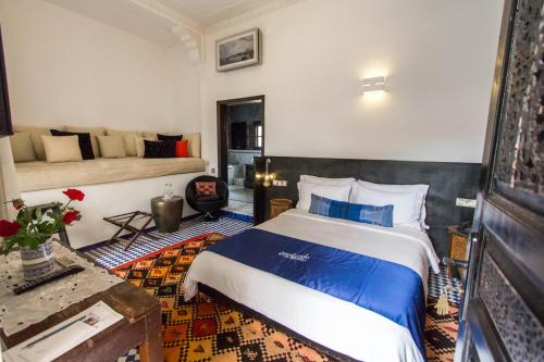a bedroom with a large bed in a room at Riad Braya in Fès