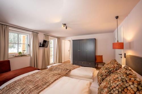 a bedroom with two beds and a large window at Apartment Schichlreit in Annaberg im Lammertal