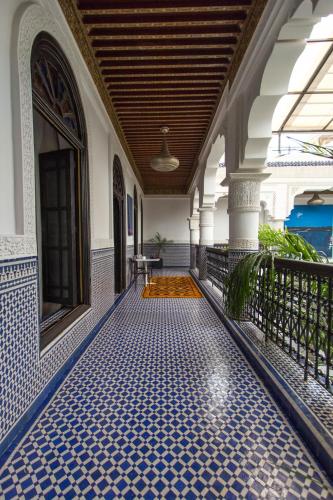 a tiled floor in the hallway of a building at Riad Braya in Fès