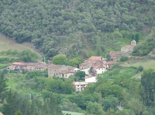 a group of houses on the side of a hill at Apartamentos La Condesa in Valmeo