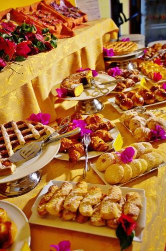 a table topped with lots of different types of food at Arciduca Grand Hotel in Lipari