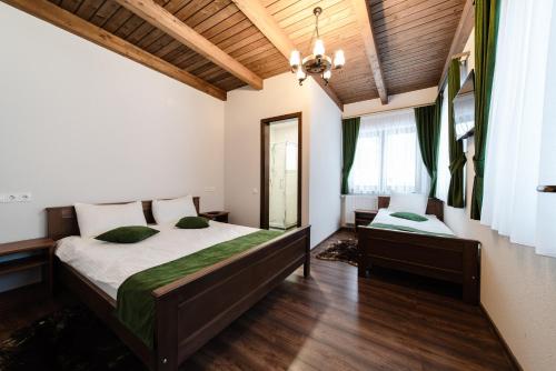 מיטה או מיטות בחדר ב-Transylvanian Relax House