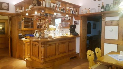 a kitchen with a large wooden island in a room at Hotel-Restaurant-Krone in Bad Brückenau