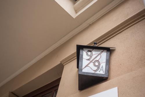 a sign hanging on the side of a building at Simply Modern Apartments in Toruń