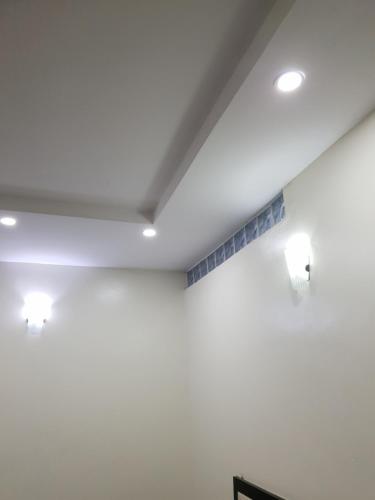 a room with two lights on a white wall at DELIGHTFUL ! 3 BEDROOM TERRACE DUPLEX EN-SUITE ORCHID RD LEKKI AIRCON WiFi in Lagos