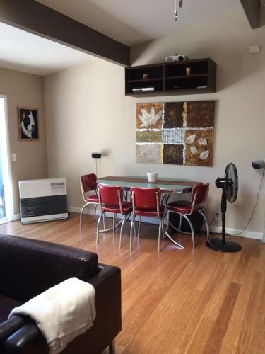 a living room with a table and chairs at 3 BR Channel House with Dock in Lakeport