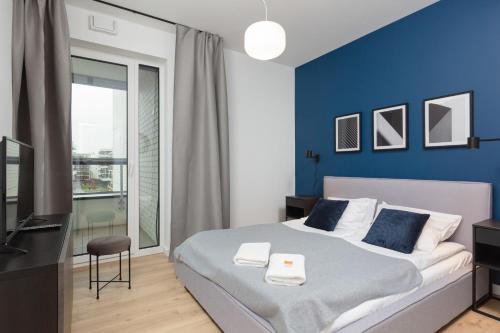 Posteľ alebo postele v izbe v ubytovaní Artistic Żoliborz Apartments by Noclegi Renters