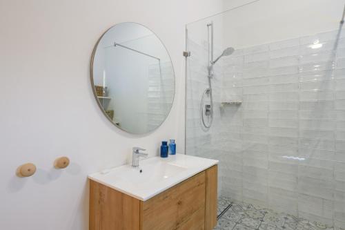 a bathroom with a sink and a mirror and a shower at San Lameer Villa 2609 - 3 Bedroom Superior - 6 pax - San Lameer Rental Agency in Southbroom