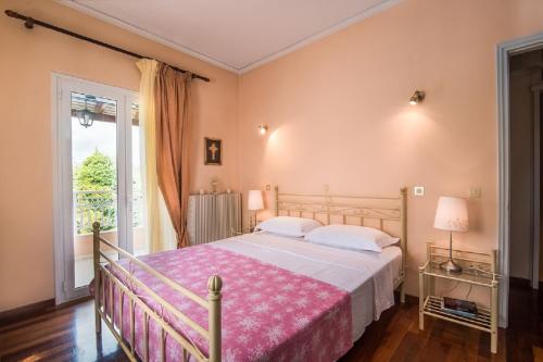 Posteľ alebo postele v izbe v ubytovaní Chara's House
