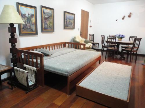 מיטה או מיטות בחדר ב-Apartamento Centro Gramado