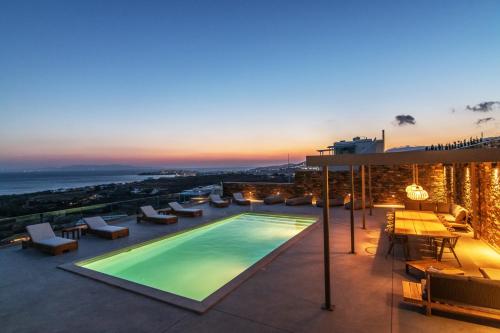 a pool on the roof of a building with a view at Blue Gres Villa Tinos in Tinos Town