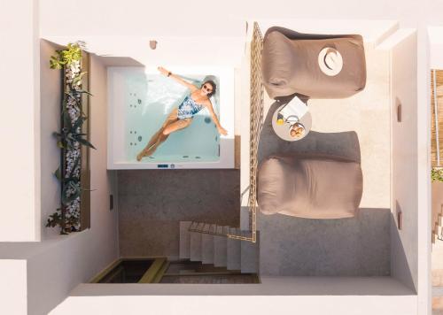 a staircase in a house with a picture of a woman at Neratze Hammam Suites in Rethymno Town